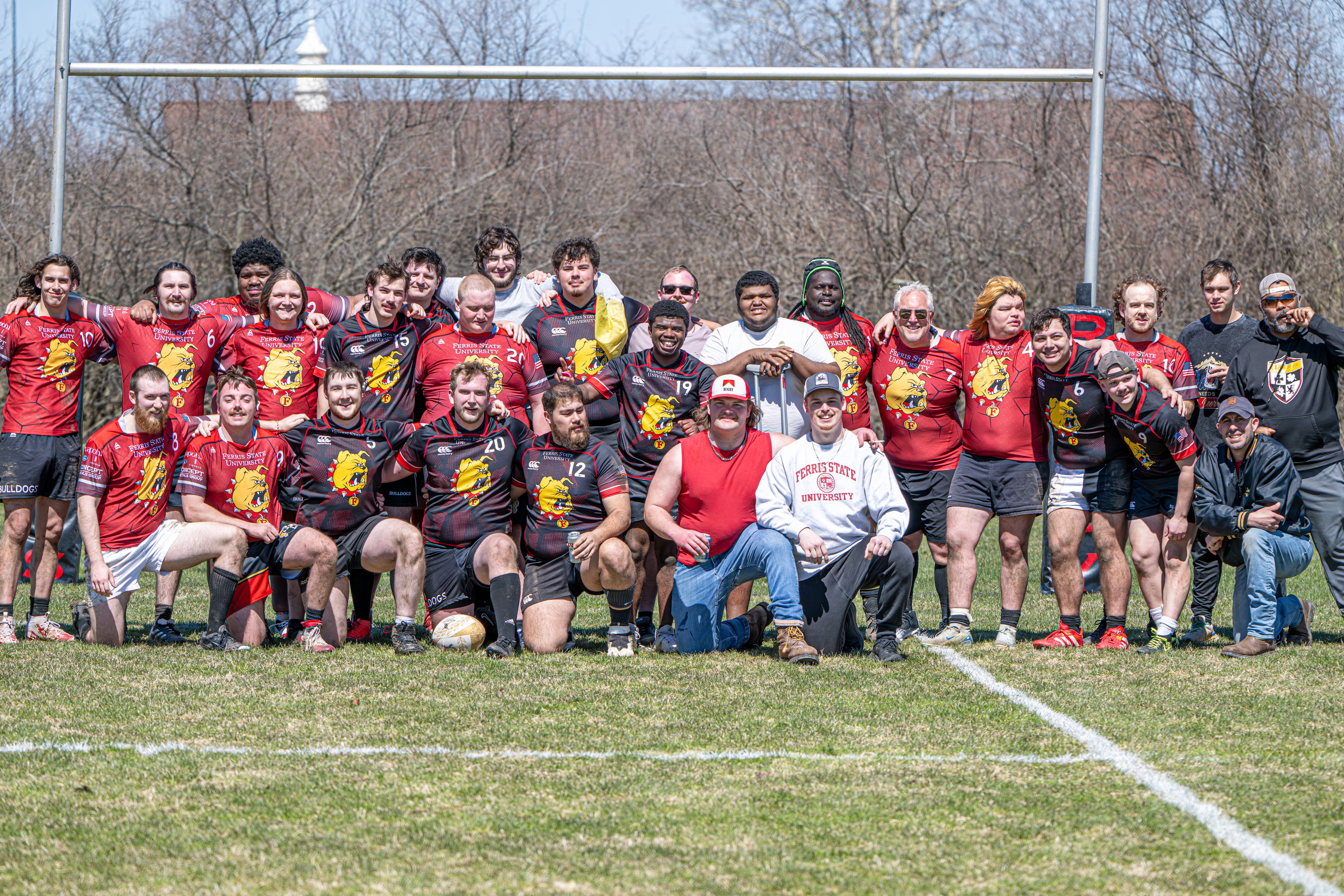 Ferris State Rugby players, coaches, and supporters gathered for a team photograph